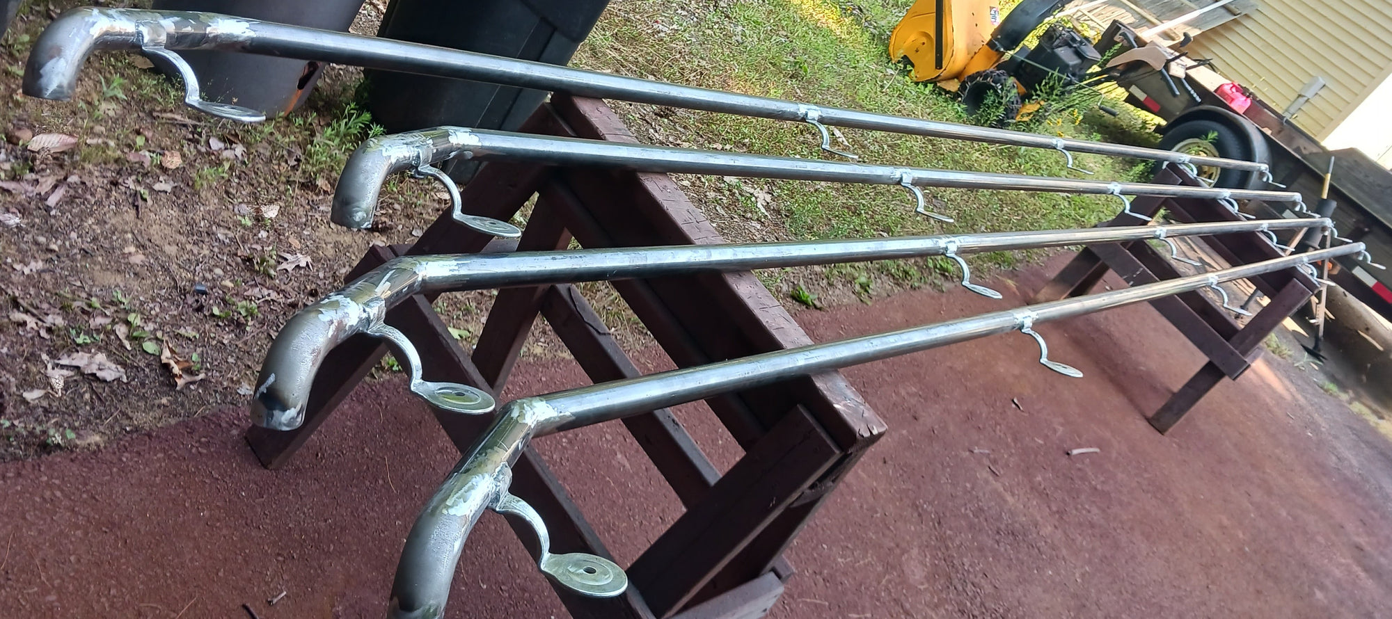 Here's a picture of 4 out of 33 handrails for these units. This was after contour grinding and before primer