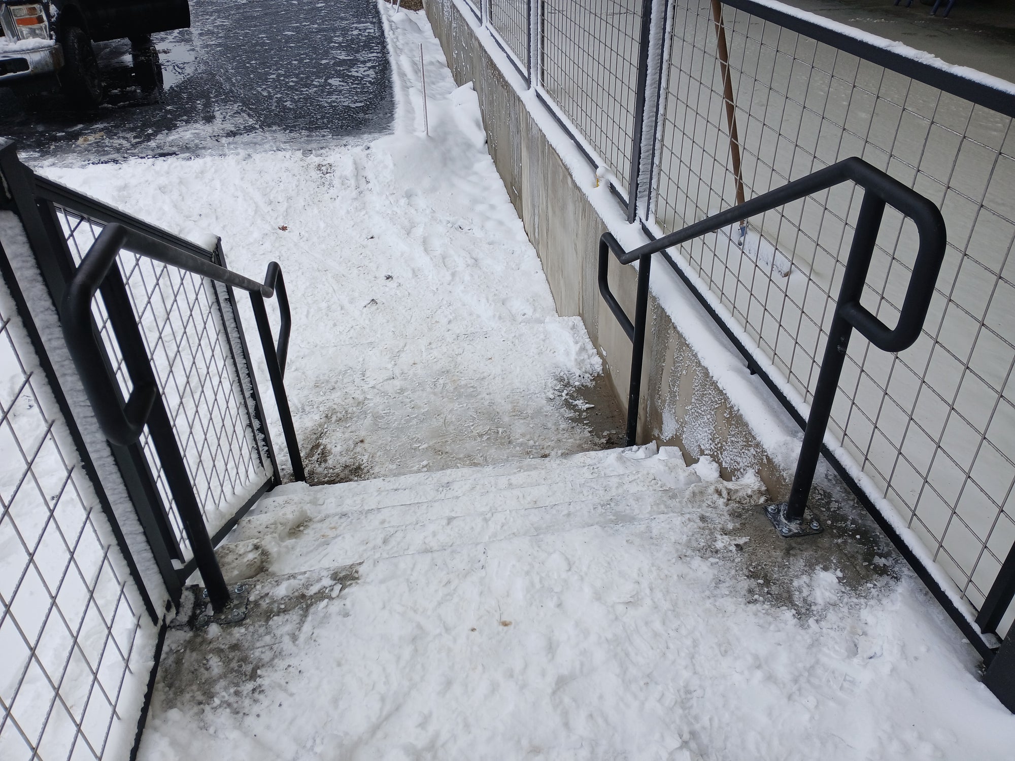 Here's a perspective walking down these concrete steps with the new pair of railings in place. If you need railings for your residence or commercial project, drop me an email at info@macsmiscmetals.com