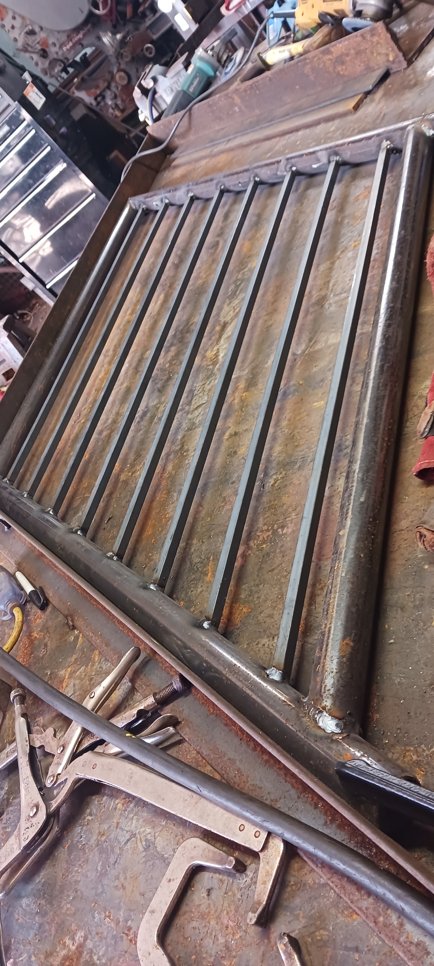 One of the 11 guard rails after fitting and welding all of the pickets in place.