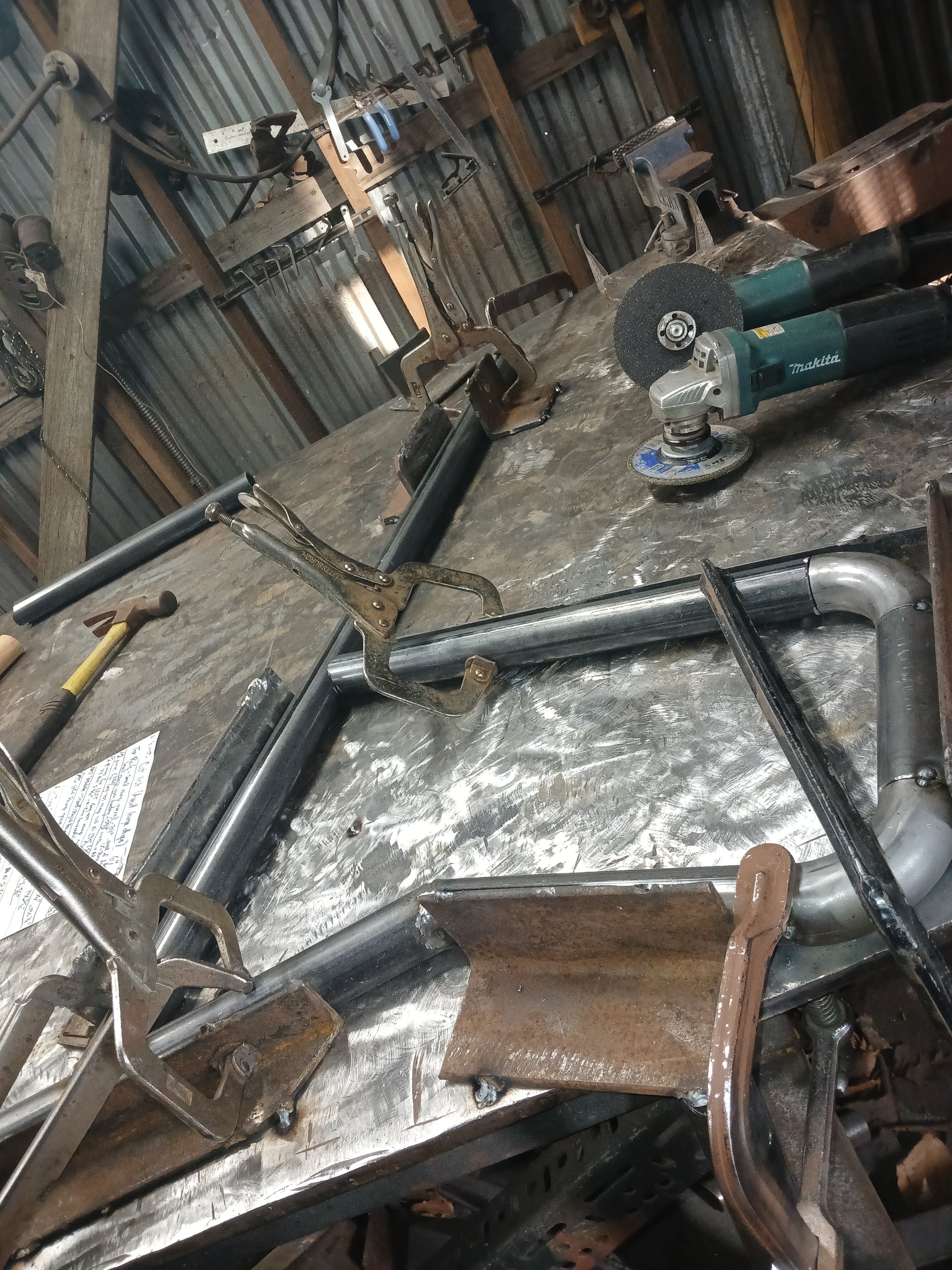 There was an old brick building next door to the condos that needed a pair of railings for the rear entrance.  This shows the fabrication of the front return of one of the two.