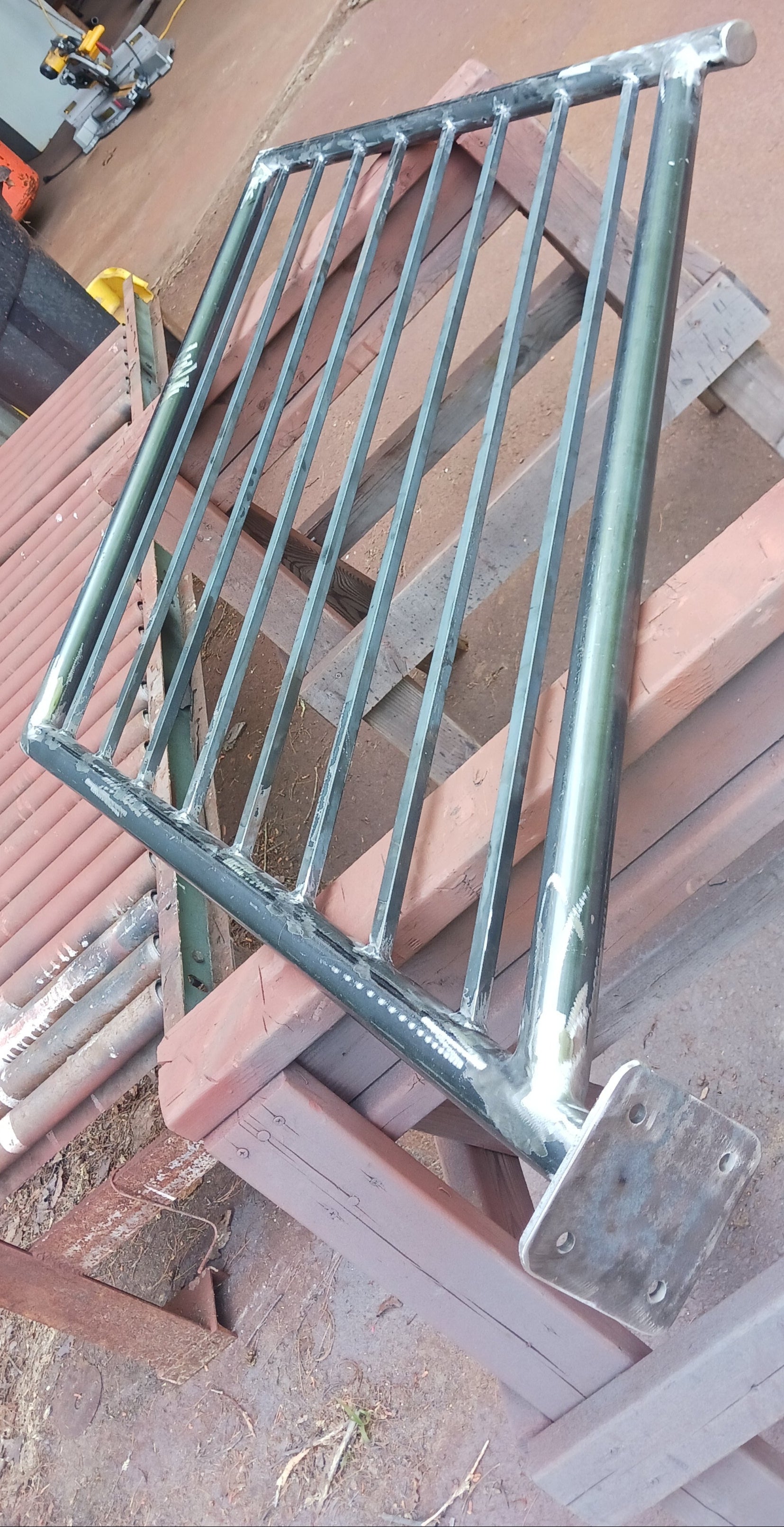 After contour grinding, those corners are as smooth as glass.  Spatter removal is tedious because of all of the pickets but it's important that no weld spatter is left behind for safety purposes and for looks as well.